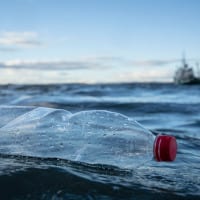 Empty plastic bottle floating in the sea