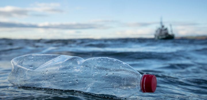 Empty plastic bottle floating in the sea
