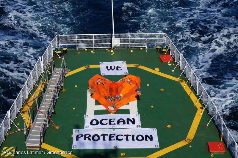 Banner reading "We Love Arctic Protection" on the helideck of Arctic Sunrise.