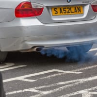 exhaust of a car with fumes coming out