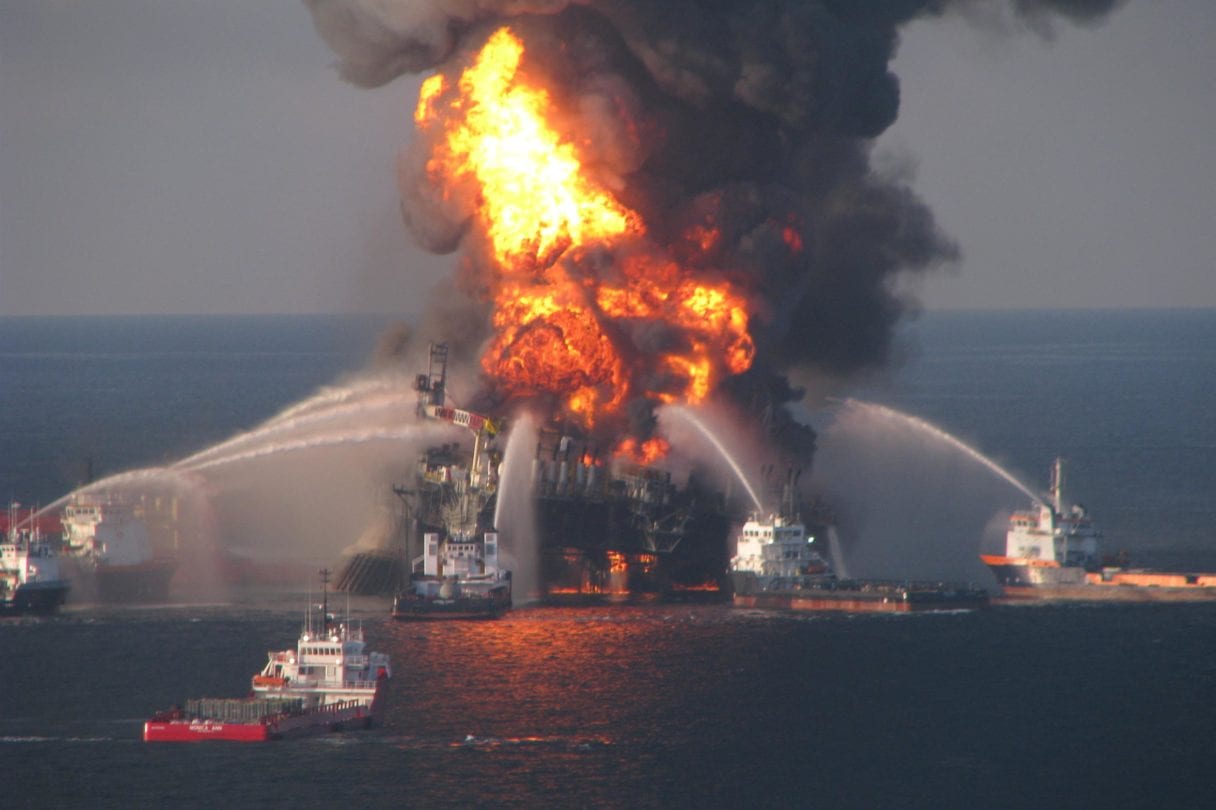 Fire response boats hosing water onto the burning deepwater horizon oil rig