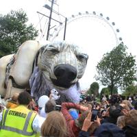 Giant polar bear puppet in front of London Eye