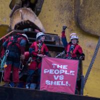 activists on top of oil rig