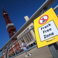 "frack free zone" sign hanging on Blackpool pier