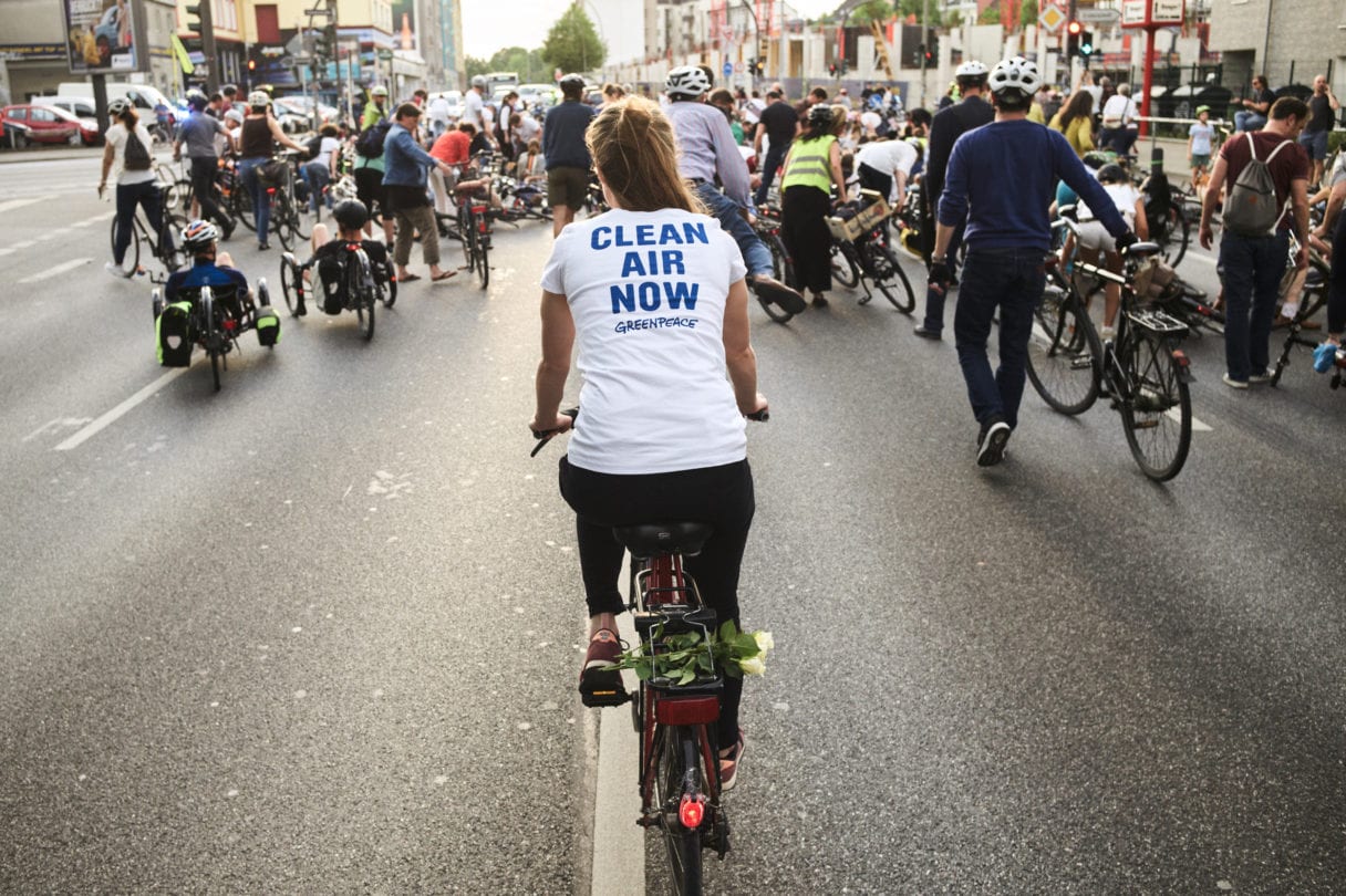 Cyclist with Clean Air Now t-shirt