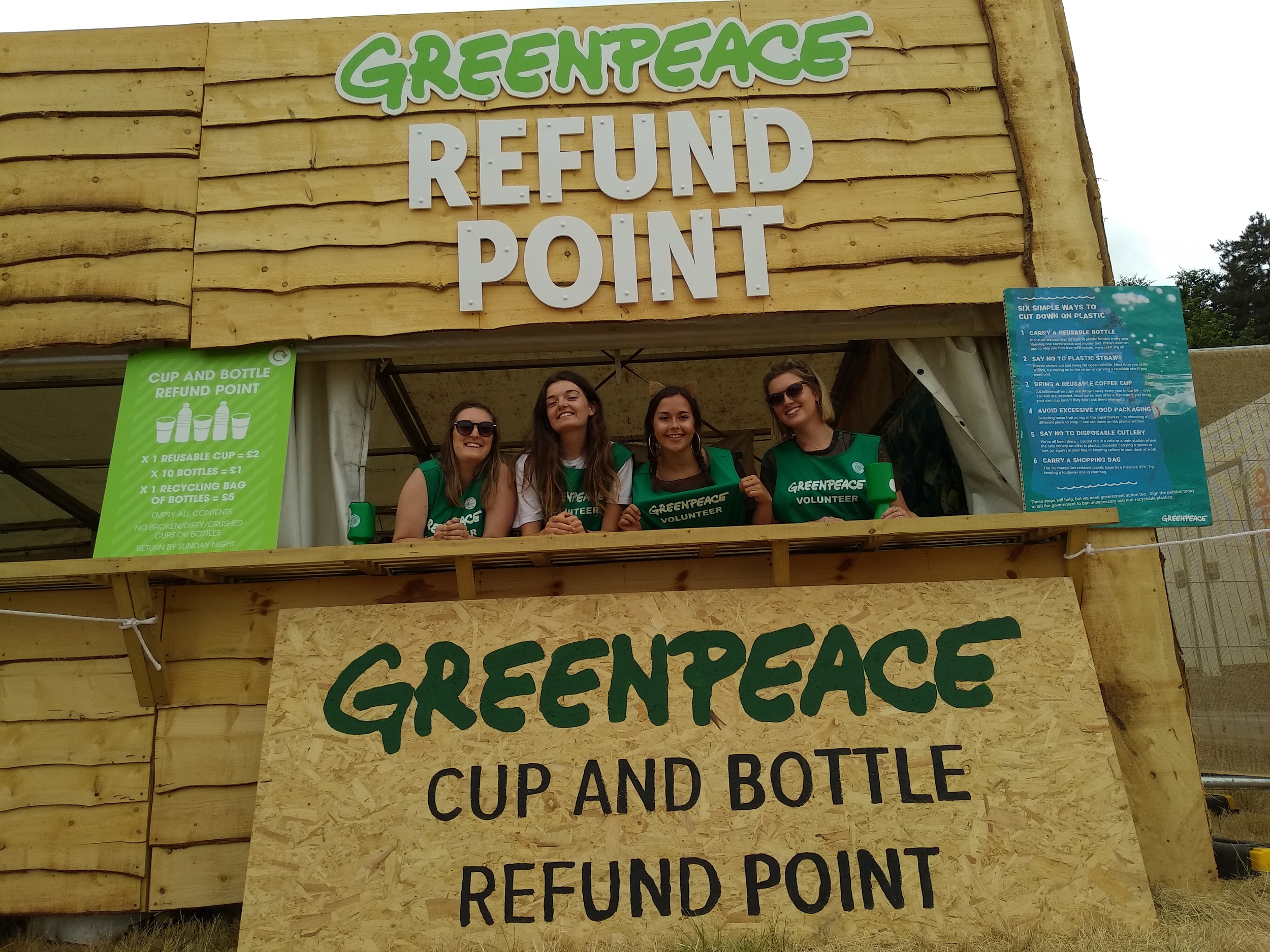 volunteers at cup and bottle refund station