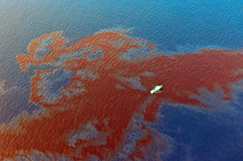 A skimmer with Clean Gulf Associates skims oil that leaked from a flow line at one of Shell's drilling sites about 90 miles off the Louisiana coast in the Gulf of Mexico. The company says about 88,200 gallons of oil leaked from the line.
