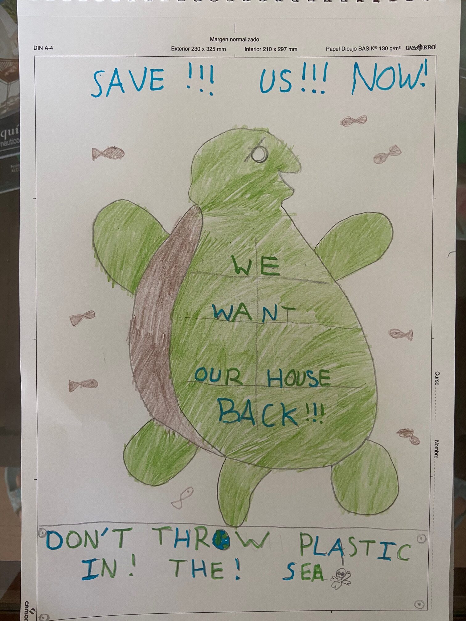 Hand-drawn child's poster showing a turtle with various ocean protection slogans around the sides