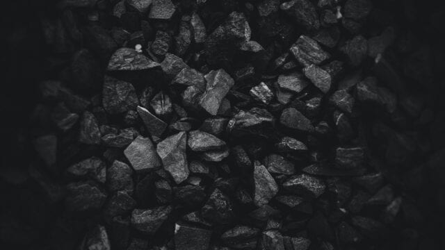 A pile of coal fills the frame