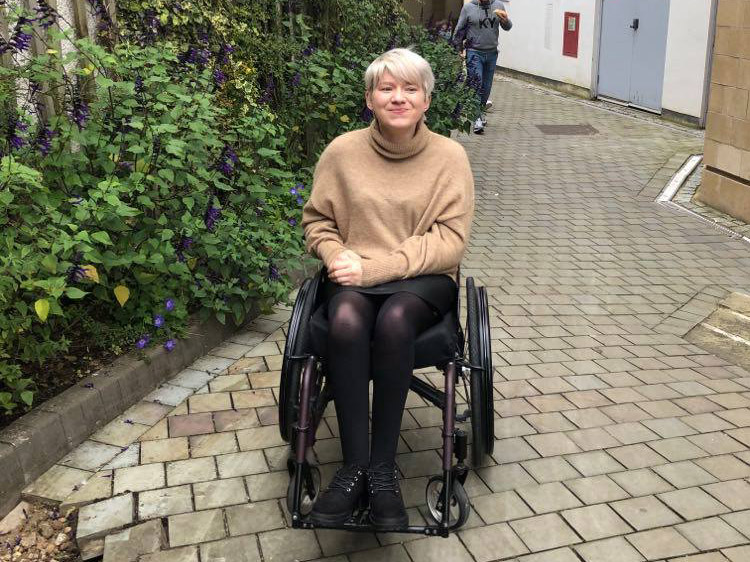 Melissa Parker outdoors in a wheelchair