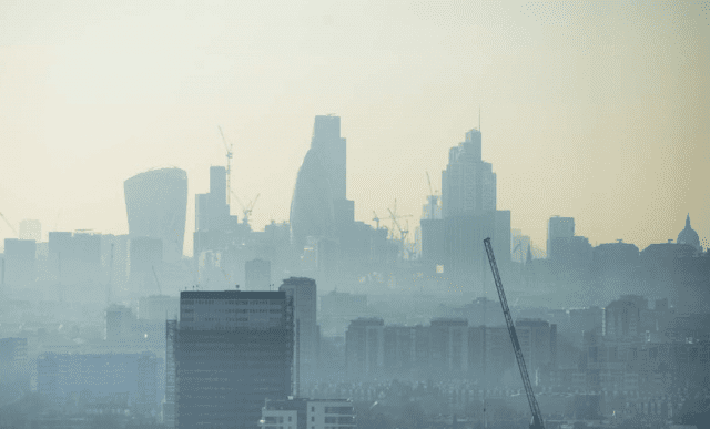London skyline with skyscrapers shrouded in fog