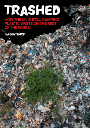 Cover of Greenpeace Trashed report shows an aerial view of a plastic waste dump