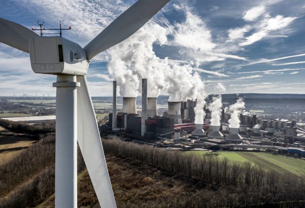Wind turbine and smoke emitted by coal power plant cooling towers