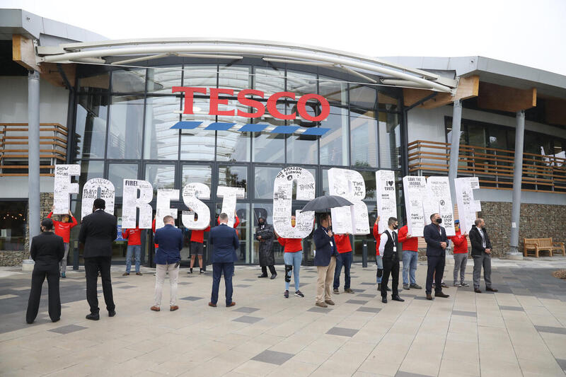 Greenpeace Activists protest outside Tesco HQ with giant letters
