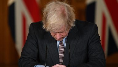 Boris Johnson bowing his head