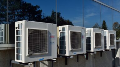A row of air conditioners. Refrigerants using HFCs cause climate change.