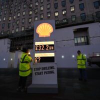 Greenpeace UK activists set up a mock petrol station price board, with Shell logo, featuring their £32.2 billion record profits on one section, and a question mark next to "payment for climate damage' on another panel. The activists set the board up outside Shell's London HQ at first light on Thursday 2 February, as Shell announced their breath-taking profits.