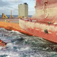 Two more Greenpeace climbers board the Shell oil platform that is being transported to an oilfield north of the Shetland Islands.