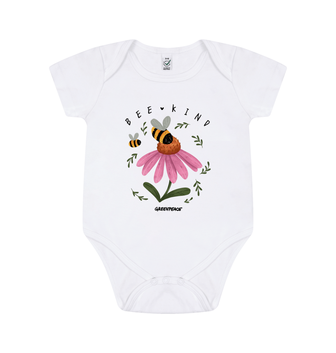 Product show of a baby grow with a picture of a bee on a flower with the slogan bee kind on it