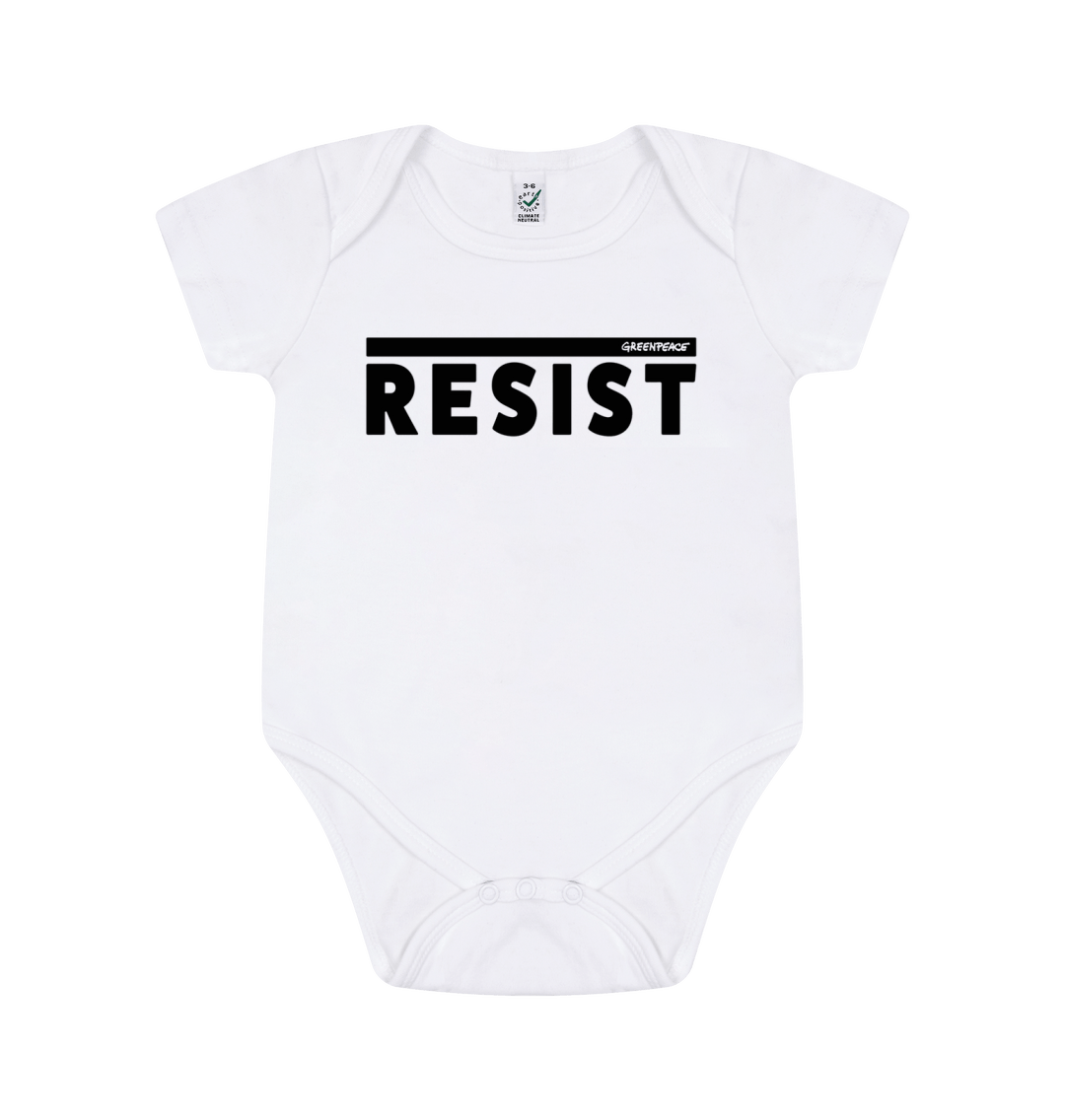 Product show of a baby grow with the word resist on the front in block capitals