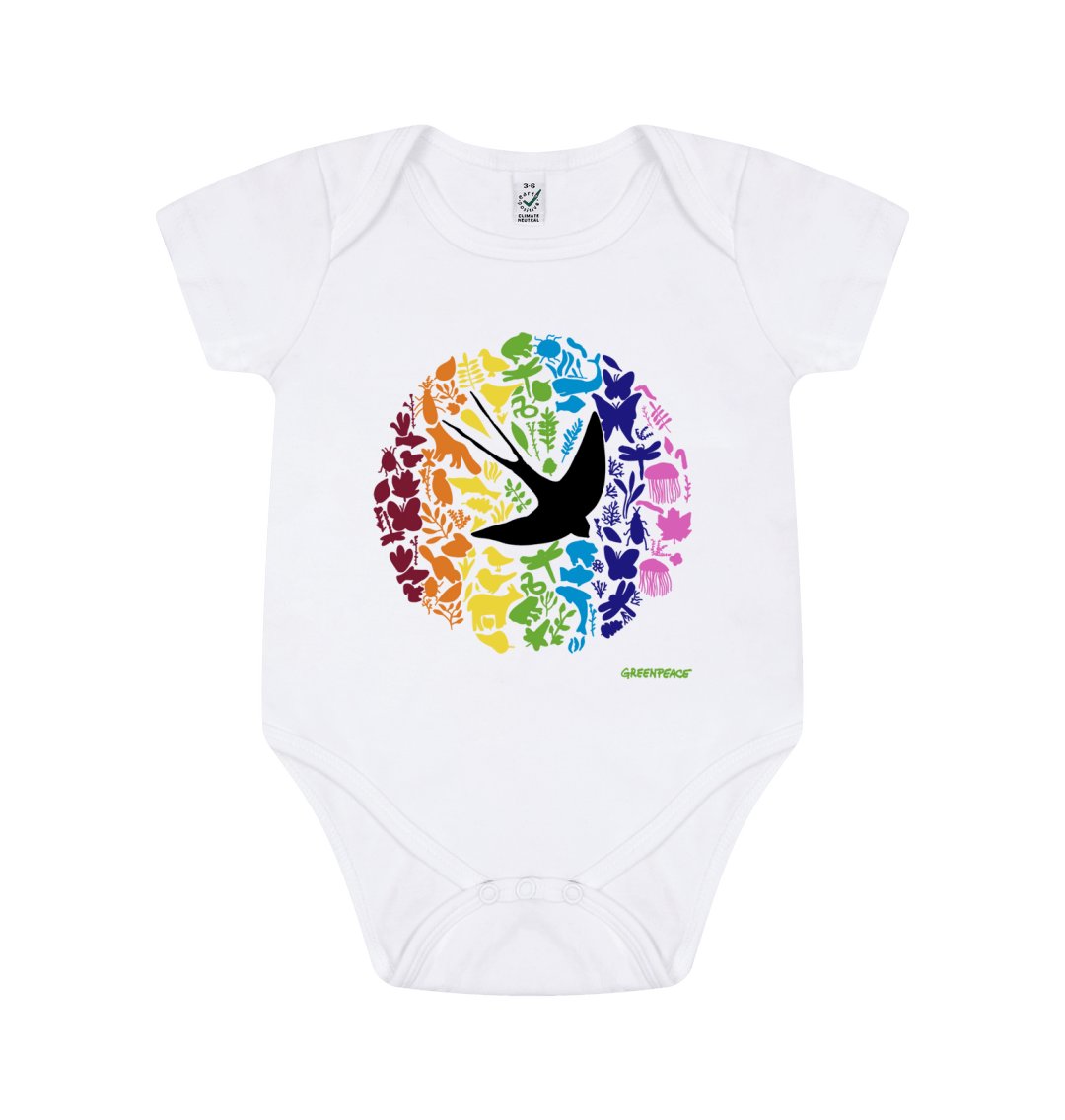 Product show of a baby grow with a rainbow pattern of plants and animals
