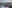 Two people on a speed boat, with 