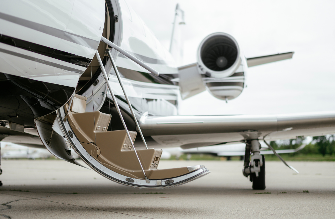 Close-up of the starcase leading up to a private jet