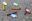 Various disposable vapes lie discarded on the street.