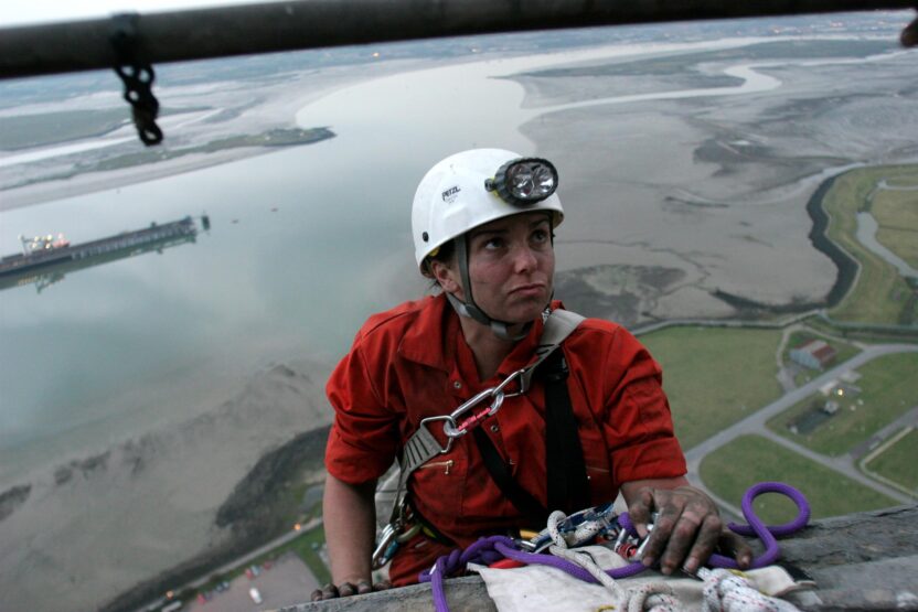 climber on side of power station