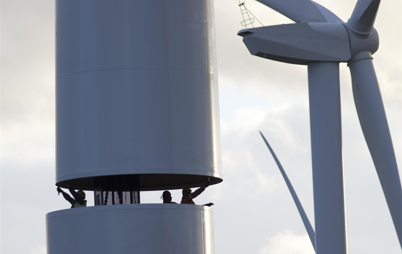Workers building a new wind farm