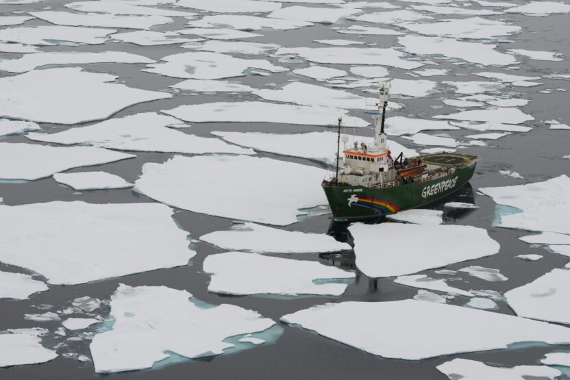 Greenpeace ship amidst ice floes in the Arctic