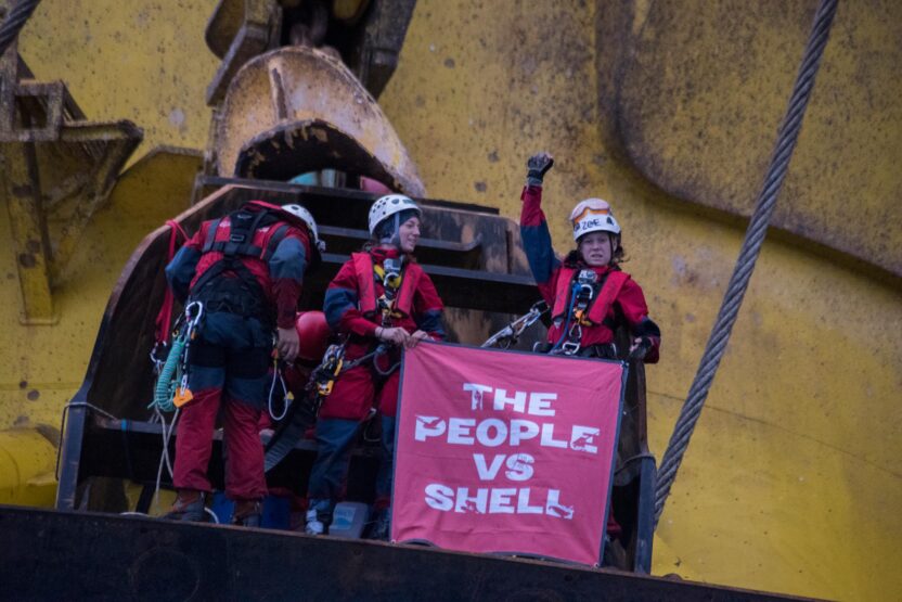 activists on top of oil rig