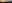 Silhouetted wind turbines against a setting sun