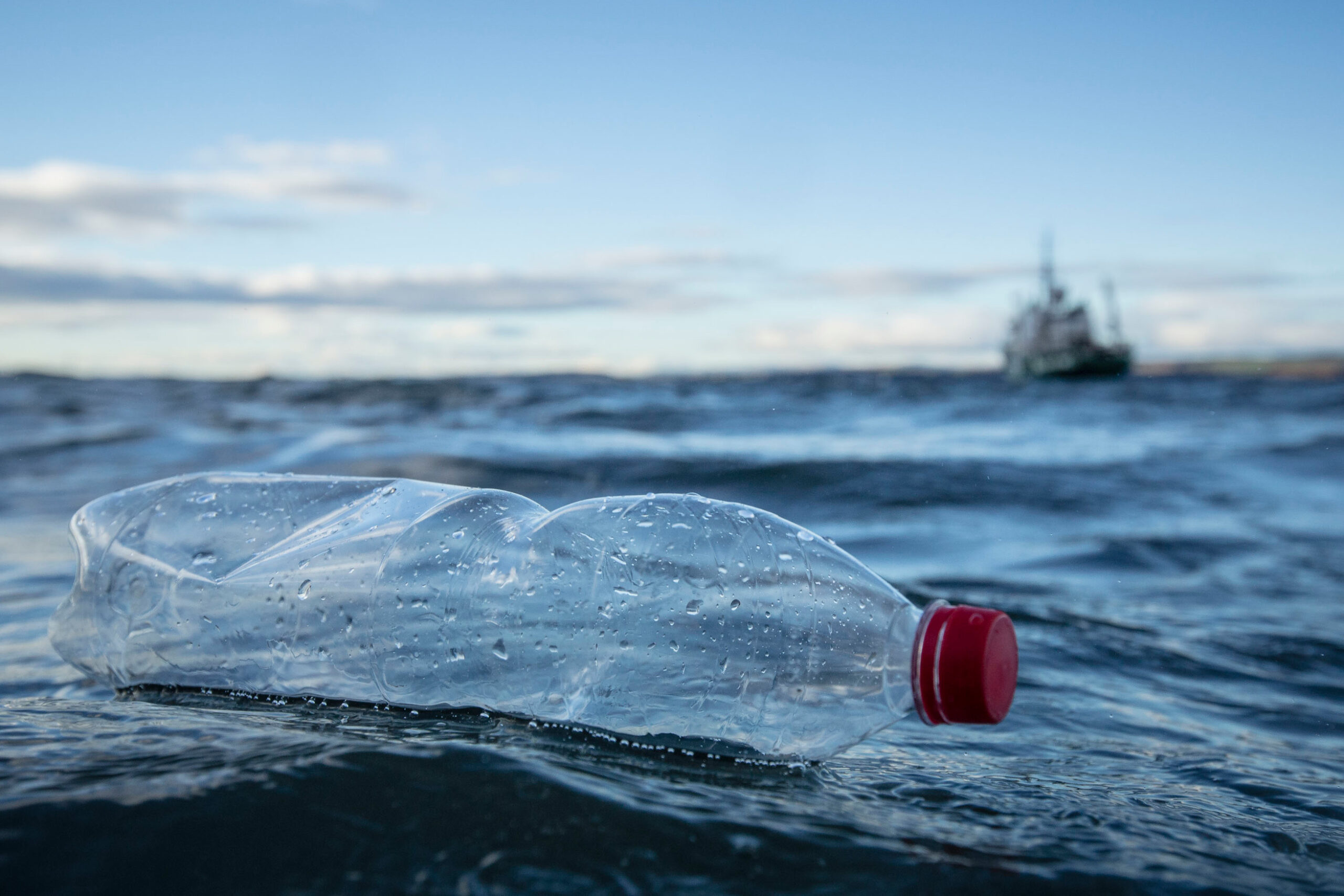 Empty plastic bottle floating in the sea