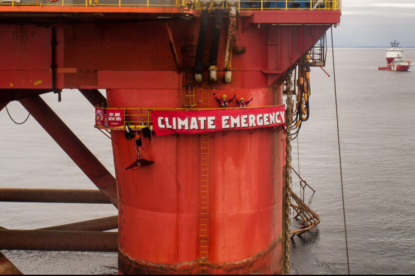 Greenpeace climbers halt BP oil rig bound for the North Sea