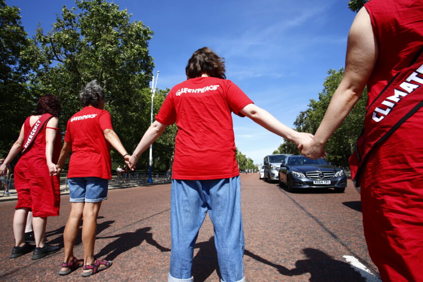Greenpeace activists form human chain