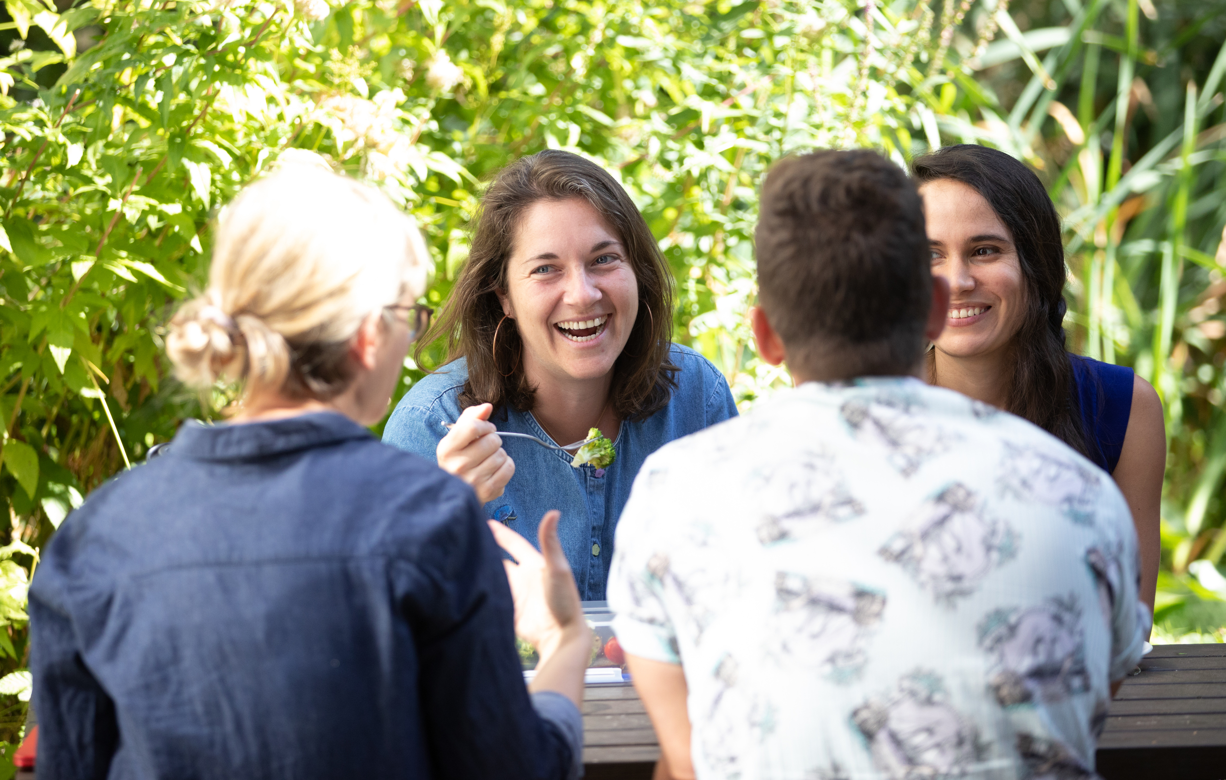 Greenpeace staff laughing with salad
