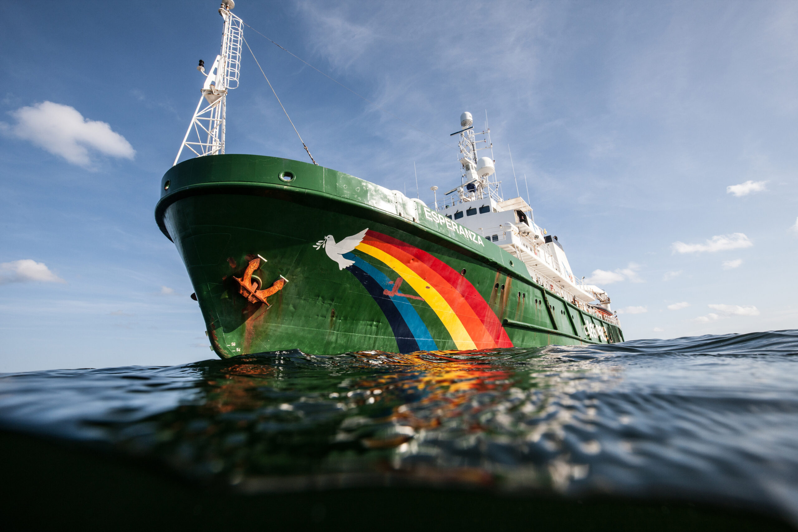 The Esperanza ship sailing on the water on a clear, sunlit day.