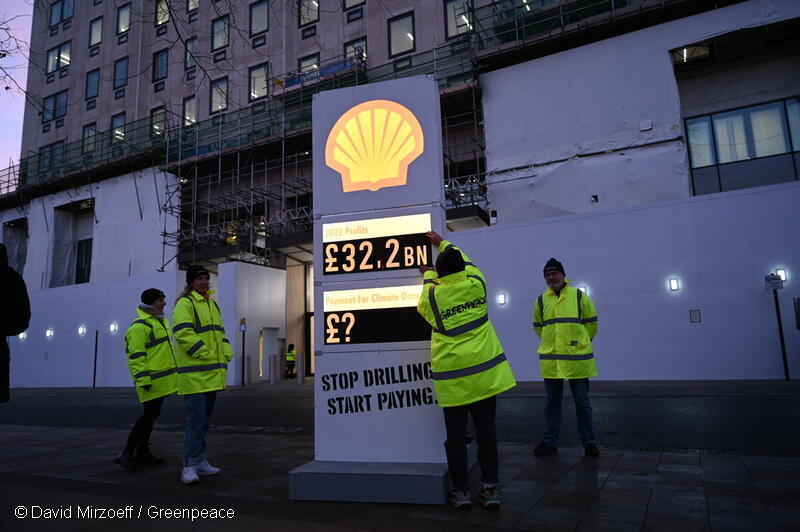 Greenpeace UK activists set up a mock petrol station price board, with Shell logo, featuring their £32.2 billion record profits on one section, and a question mark next to "payment for climate damage' on another panel. The activists set the board up outside Shell's London HQ at first light on Thursday 2 February, as Shell announced their breath-taking profits.