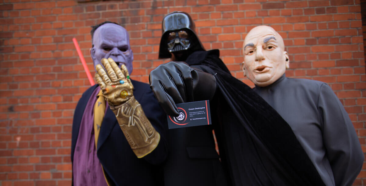 People in Thanos, Darth Vader and Dr Evil costumes pose for the camera