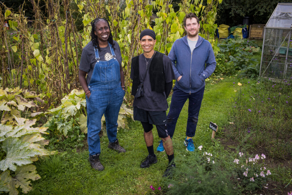 Portrait of artists, JC Niala, Julia Utreras and Sam Skinner in an allotment.