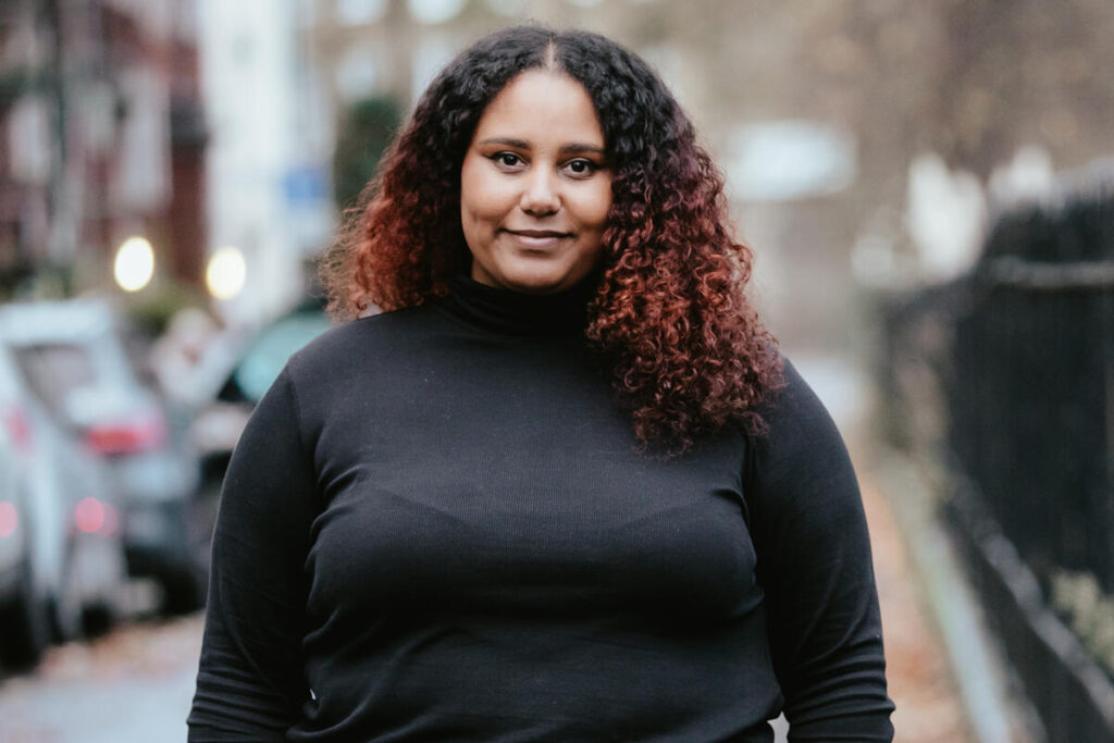 Portrait of Fauziya Johnson on a city street