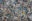 Overhead view of a jumble of dirty shredded plastic waste.