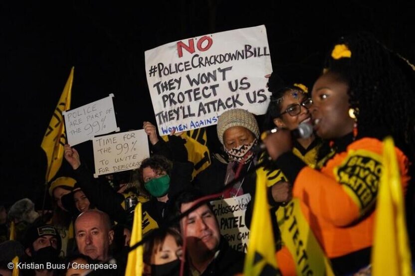 Protesters at night for Kill the Bill protest with banner that reads 
