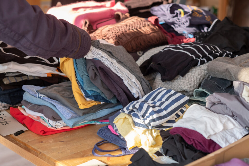 Piles of assorted clothes, neatly folded