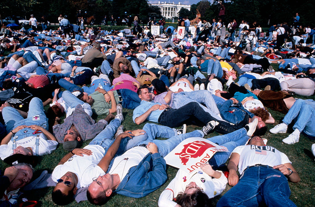 AIDS protest in front of the White House. ACT UP activists stage a die-in on the lawn in front of the Capitol building.