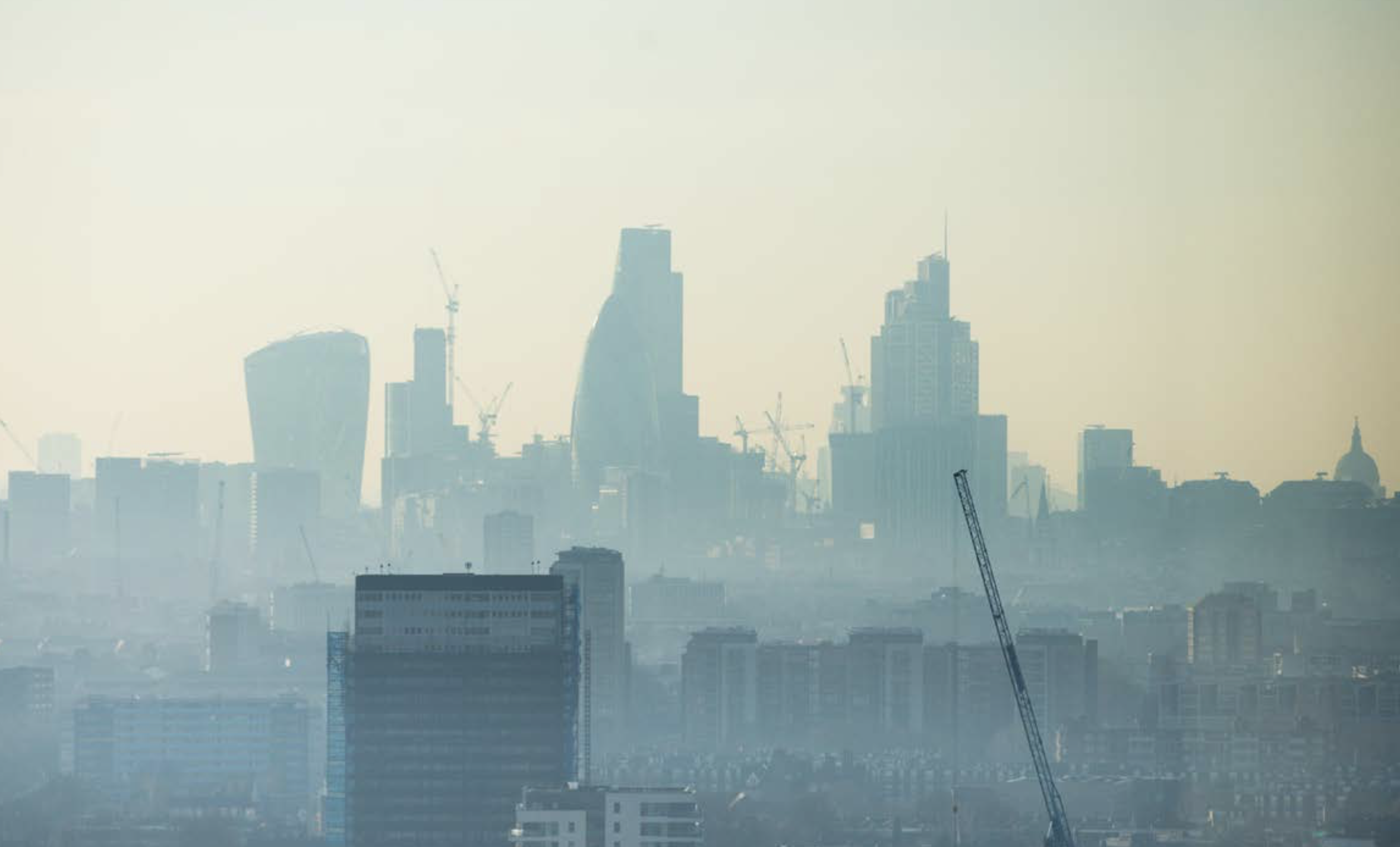 London skyline with skyscrapers shrouded in fog