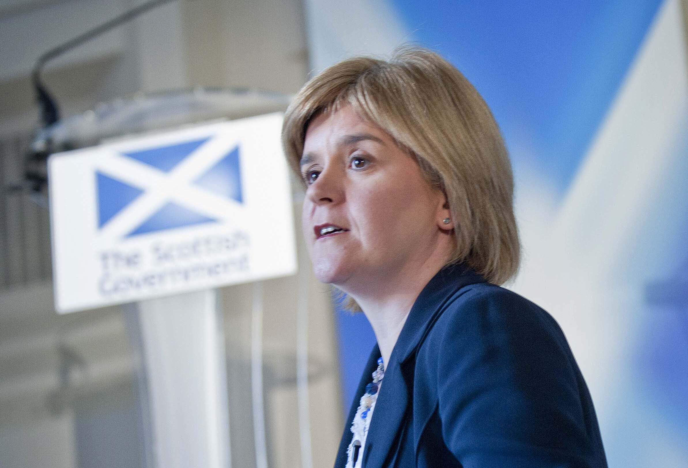 Nicola Sturgeon speaking from a podium