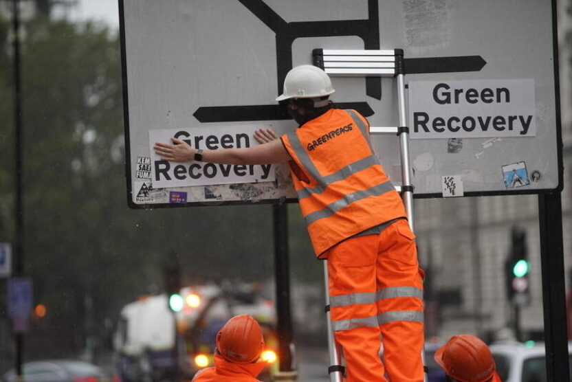 Greenpeace change Westminster road signs so that all roads lead to a ‘Green Recovery’