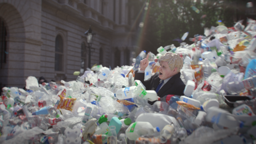 Still from animated film showing Boris Johnson being swept away by a wave of plastic waste